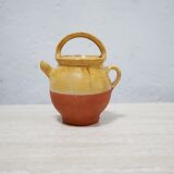 Old gargoulette pot in glazed terracotta