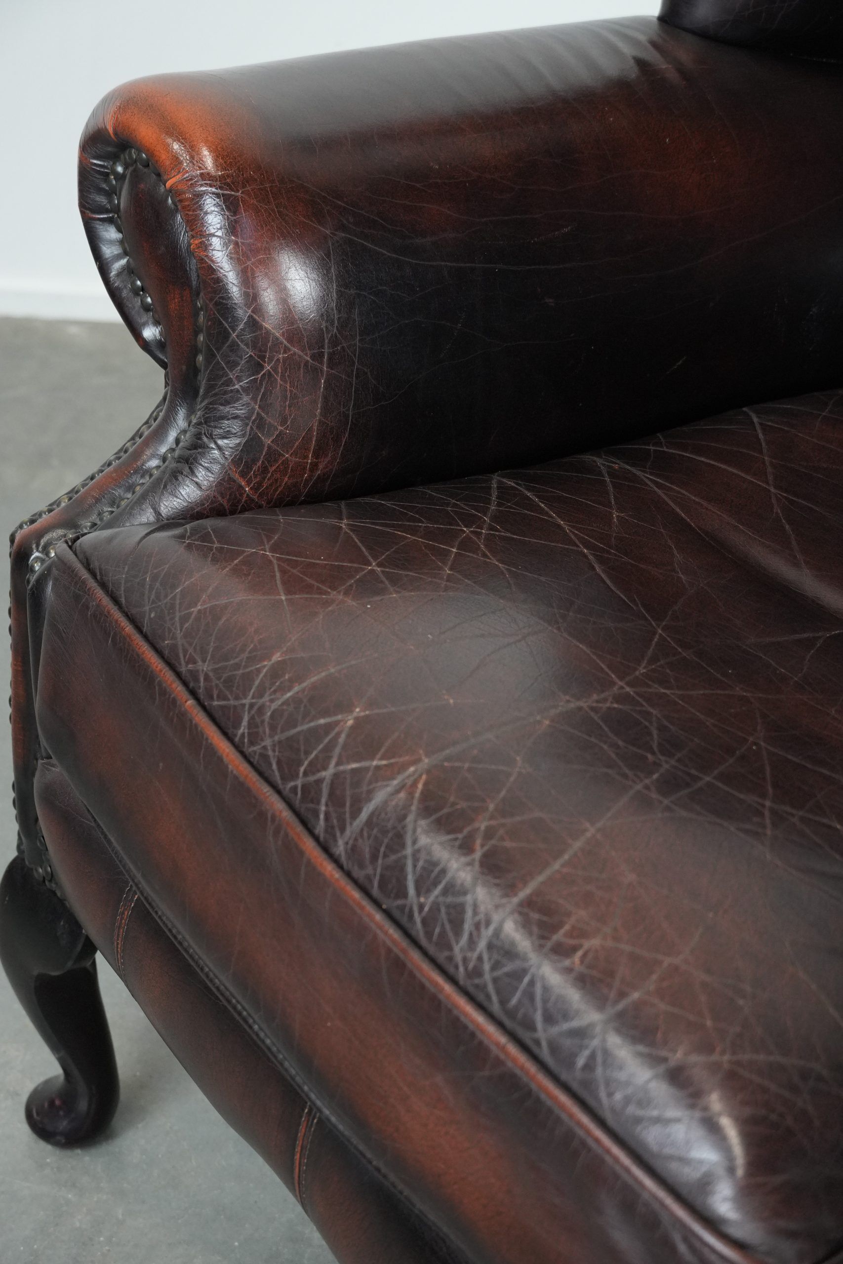 Cowhide leather Chesterfield wingback armchair in classic English style