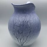 Blue glazed terracotta pitcher with hand-painted decoration, signed