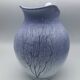 Blue glazed terracotta pitcher with hand-painted decoration, signed