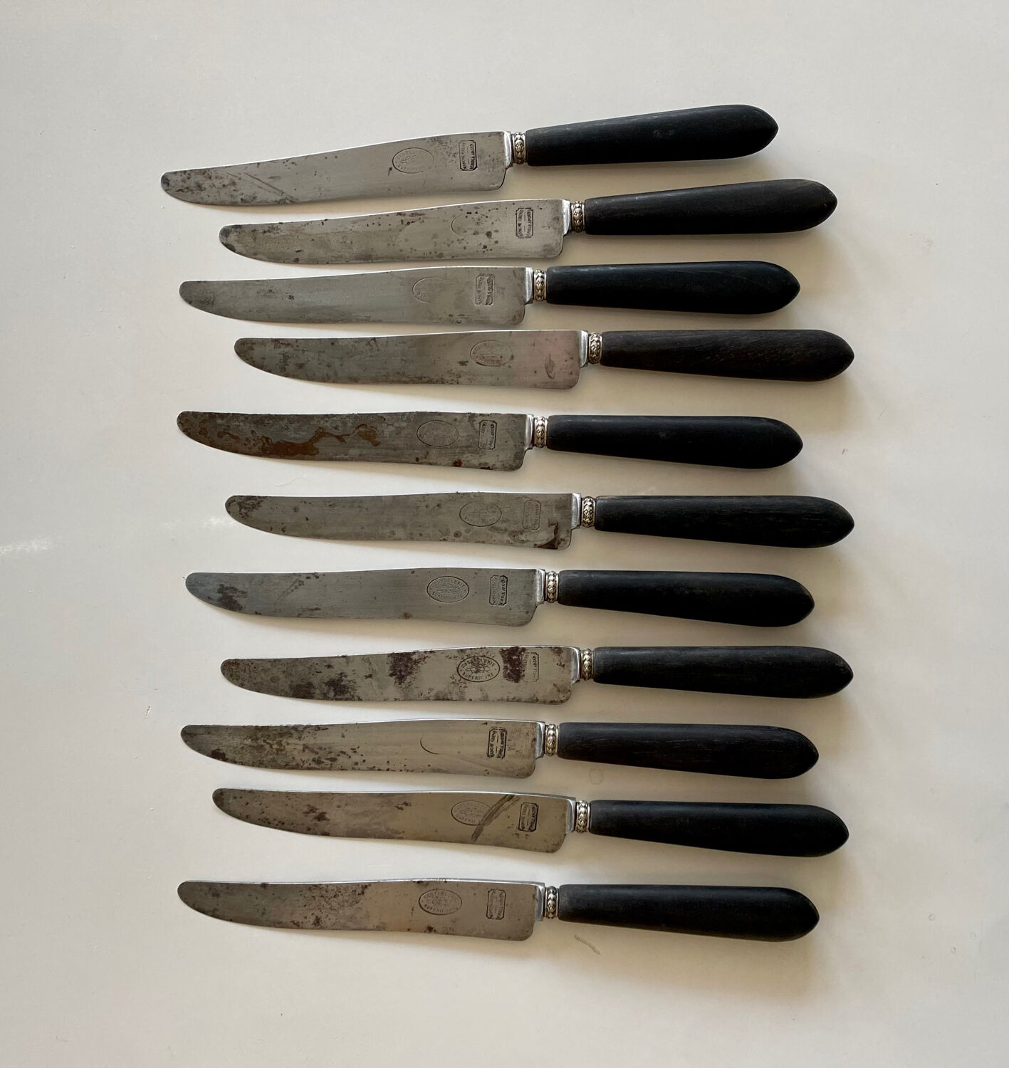 Antique table knives in ebony and steel blade