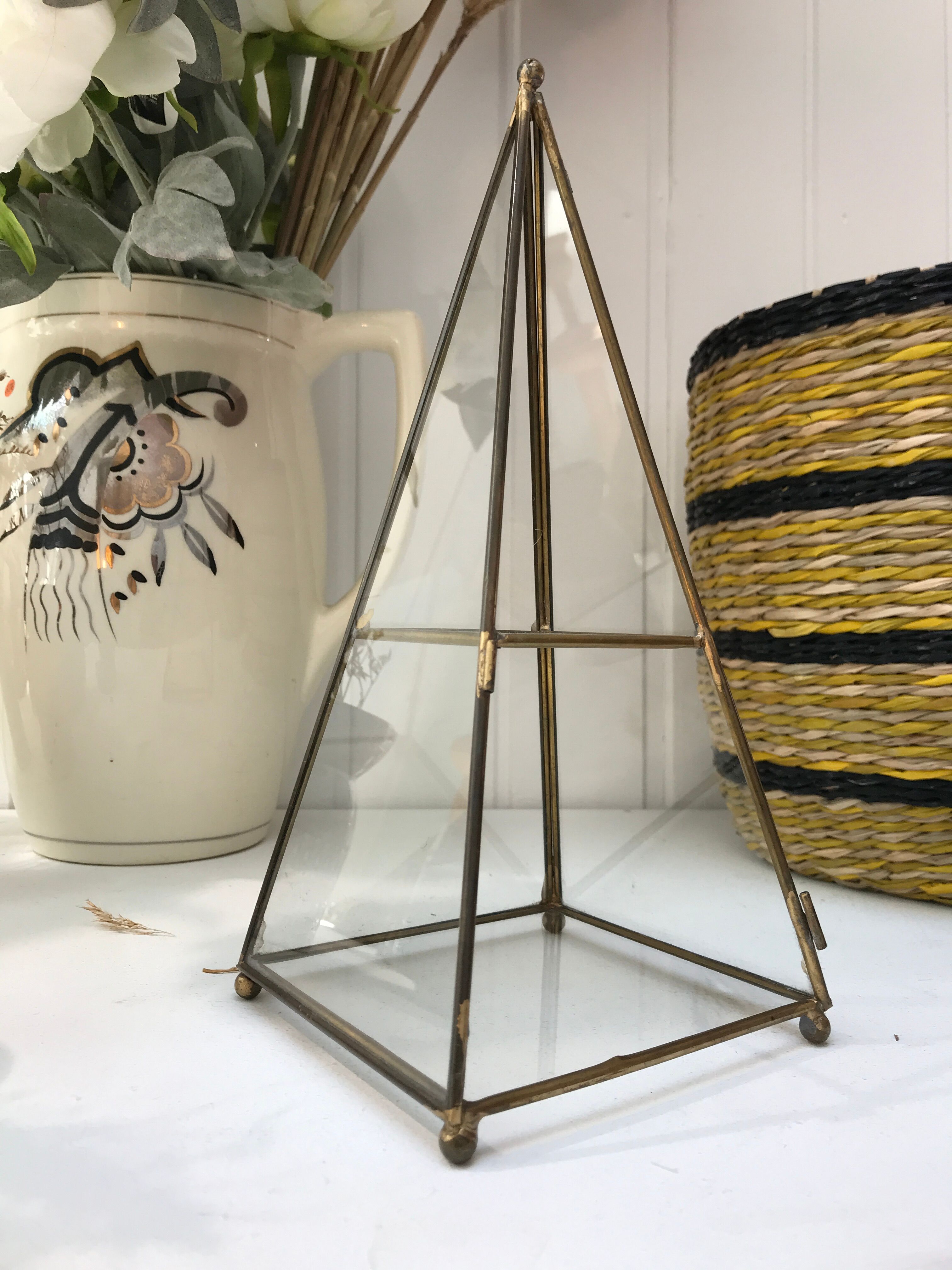 Brass pyramid showcase