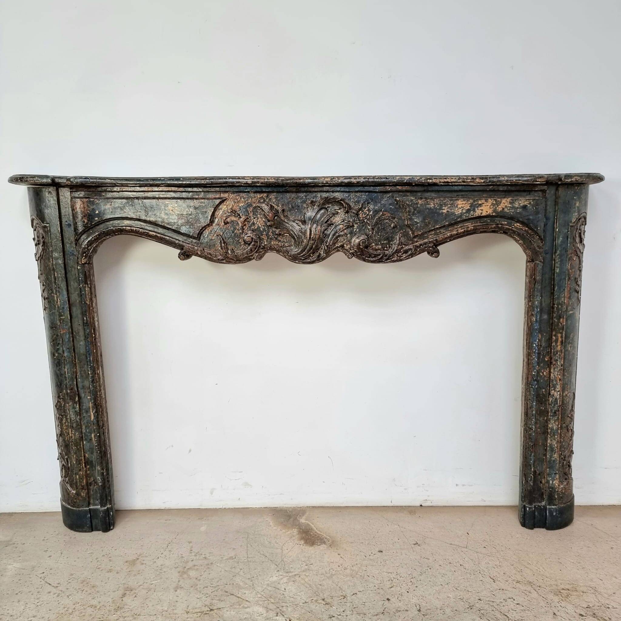 18th century carved wooden fireplace