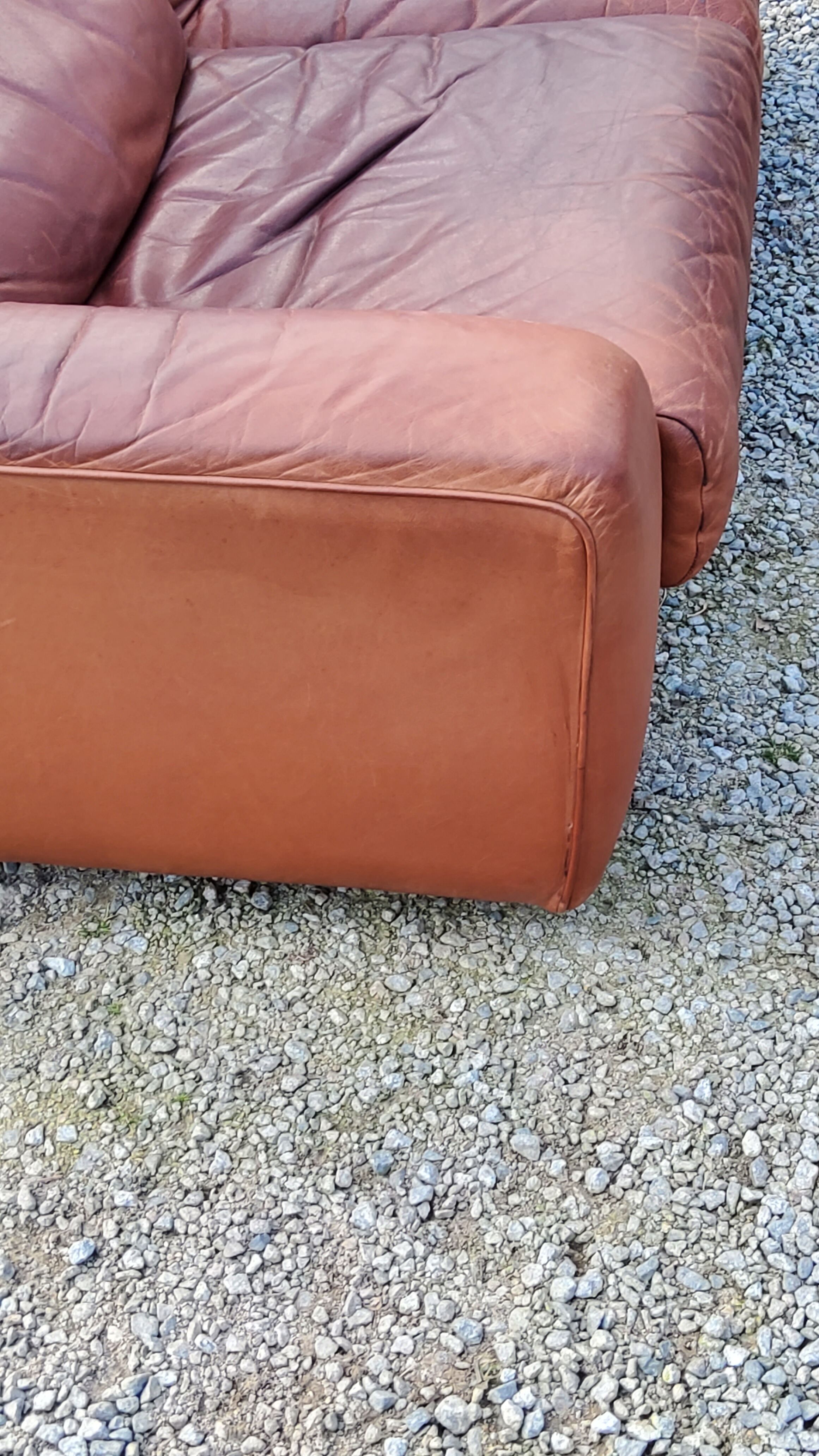 Pair of armchairs and De Sede sofa in cognac leather from the 70s/80s