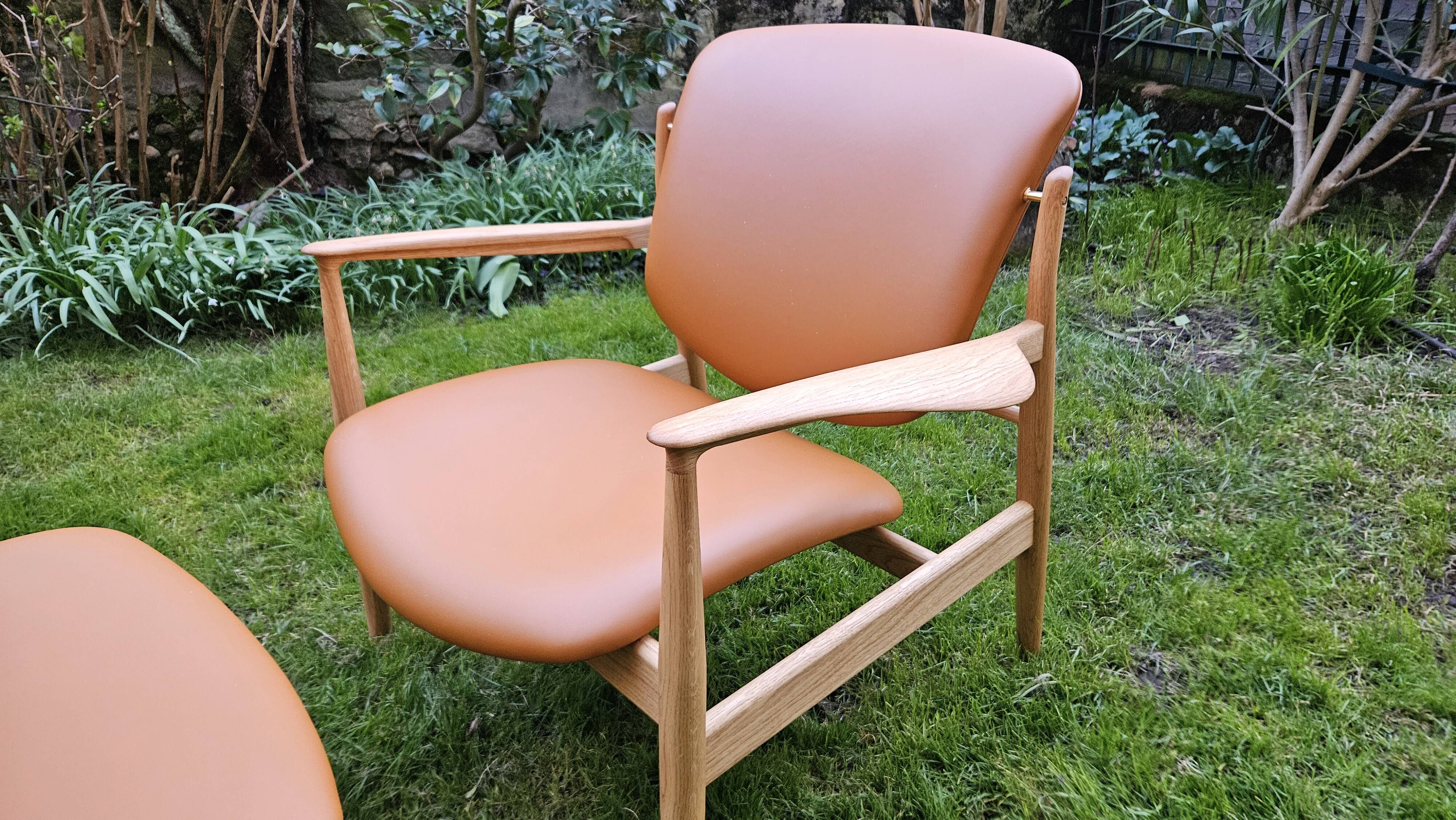2 "The French Chair" seats by designer Finn Juhl and 1 matching footrest.