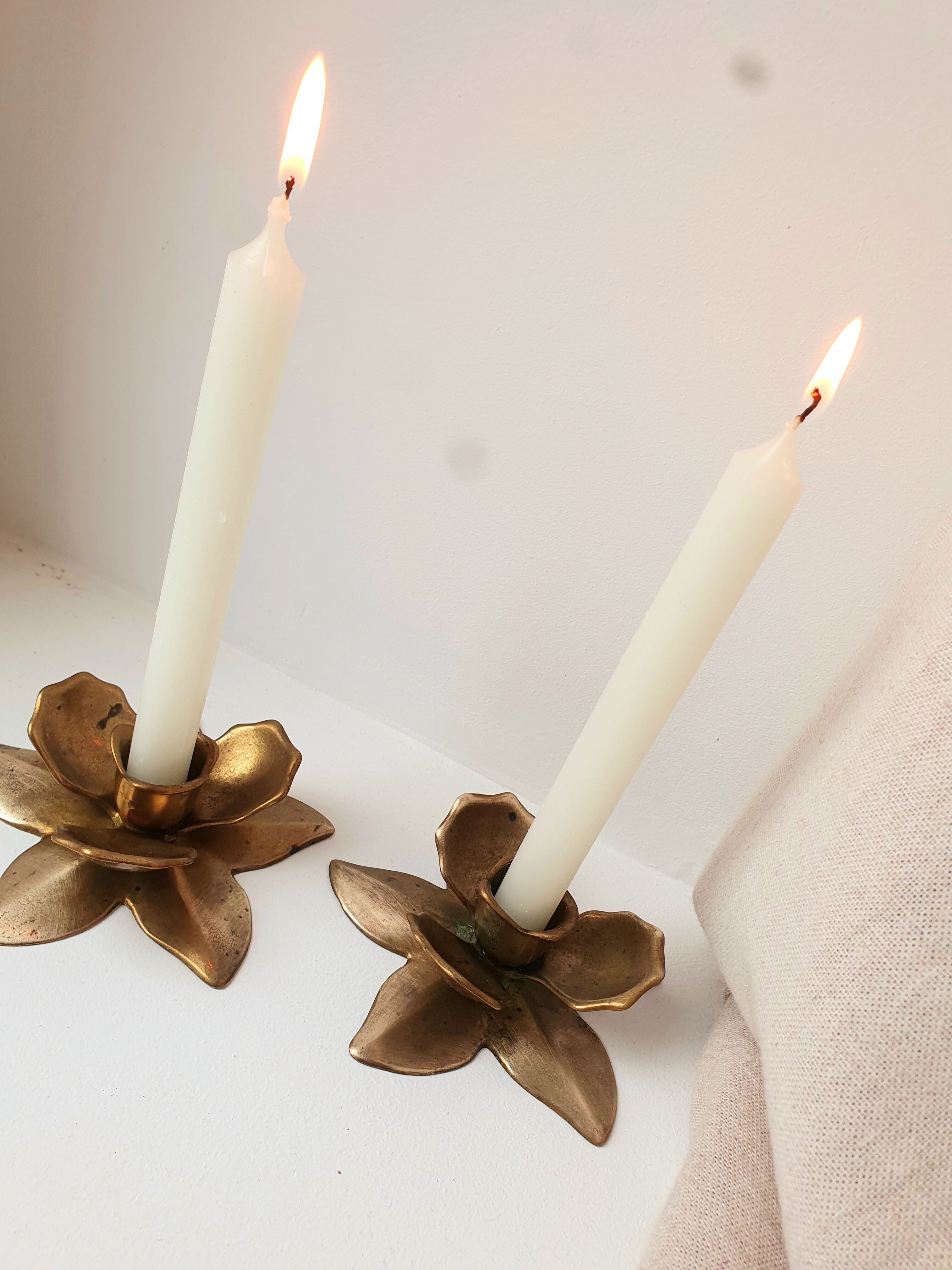 Two brass flower candlesticks