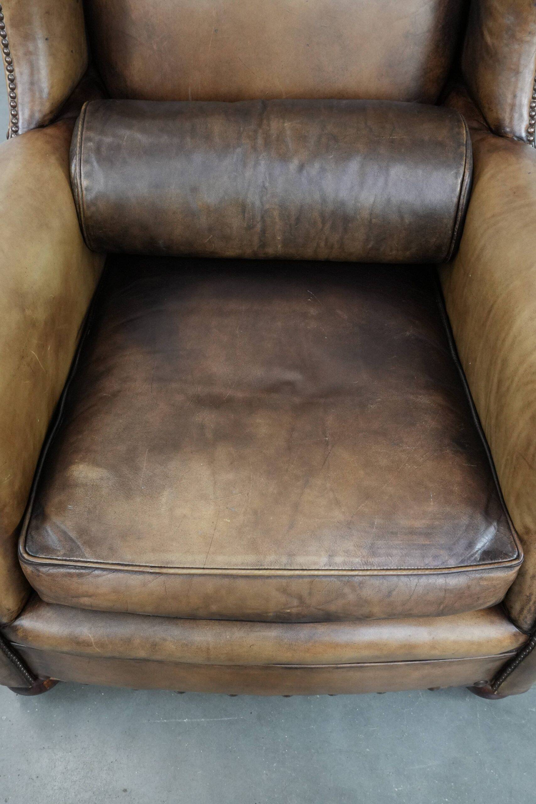Luxury and large cowhide leather wingback chair in English style