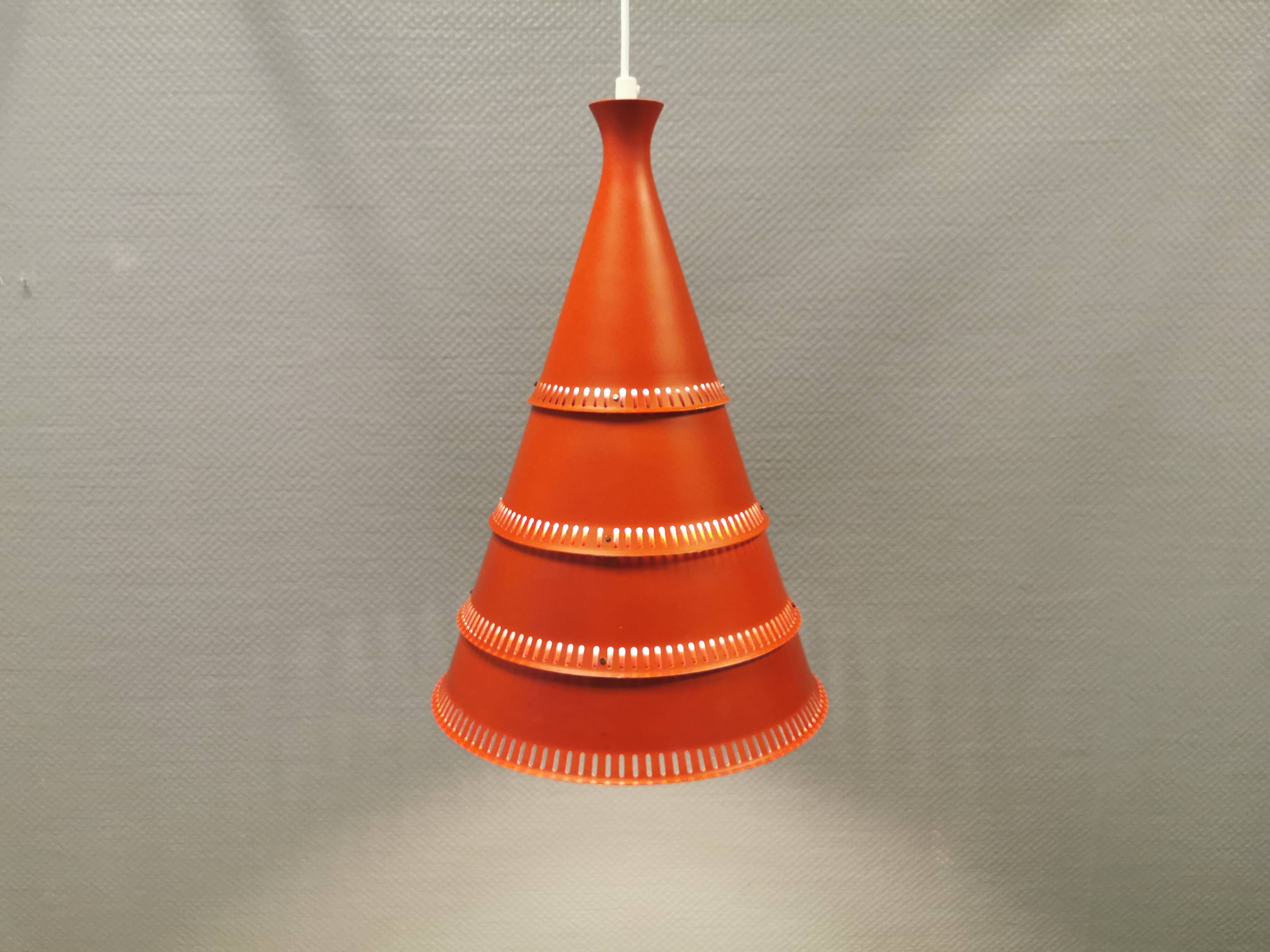 Knud Hjerting Metal layered cone-shaped hanging lamp with perforated detail on the edge. Model P208