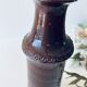 Tubular vase in glazed brown sandstone