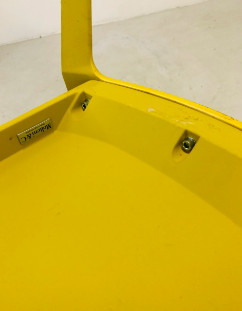 Two yellow "Alfa" chairs by Hannes Wettstein for Molteni