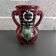 Red vase with floral decoration