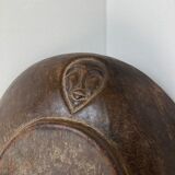 Vintage African tidy in natural wood with carved decoration in flat masks