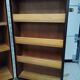 Wardrobe trunk on casters in mahogany and woven rattan.