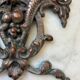 Vintage small furniture ornament in copper alloy with fish decoration.