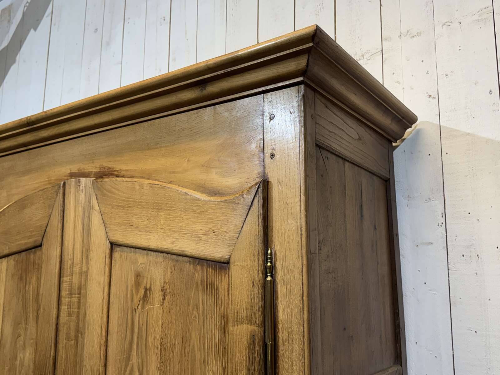 19th-century country wardrobe in blonde chestnut.