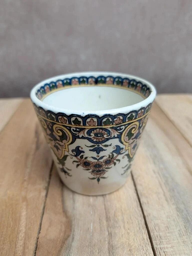Antique ironstone cup from Sarreguemines with polychrome decoration.