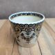 Antique ironstone cup from Sarreguemines with polychrome decoration.