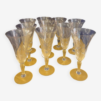 Series of 10 1950s champagne glass flutes in engraved glass tulip shape