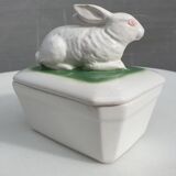 Pot terrine rabbit of Bavent in white earthenware on square of greenery