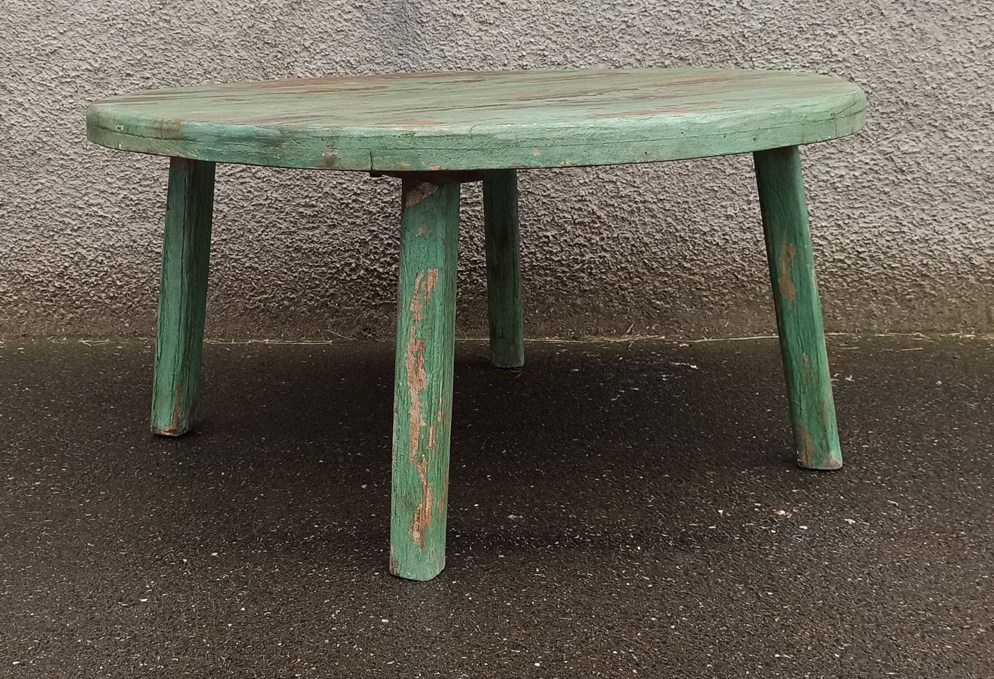 Round coffee table in old green wood