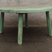 Round coffee table in old green wood