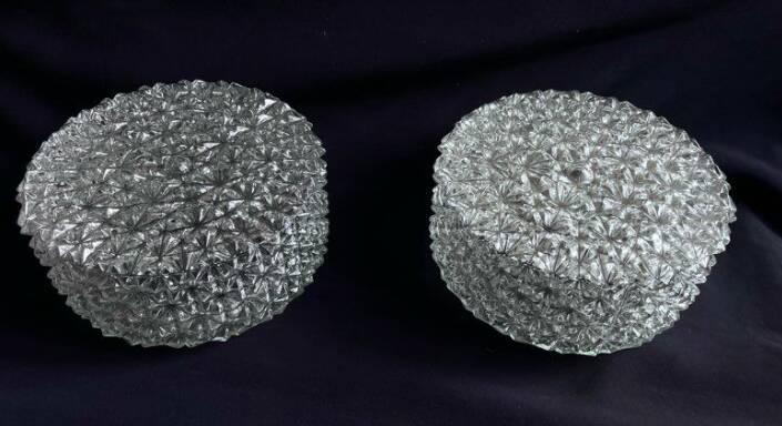 Pair of round vintage moulded glass ceiling lights.
