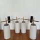 Pair of wall lights in gilded metal and opaline glass