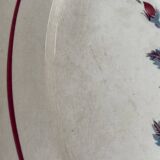 Oval plate Moulin des Loups in blue and red ceramic with a floral design.