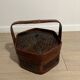 Ancient wooden and woven wicker basket,