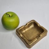Empty pocket brutalist-inspired ashtray in gilded bronze