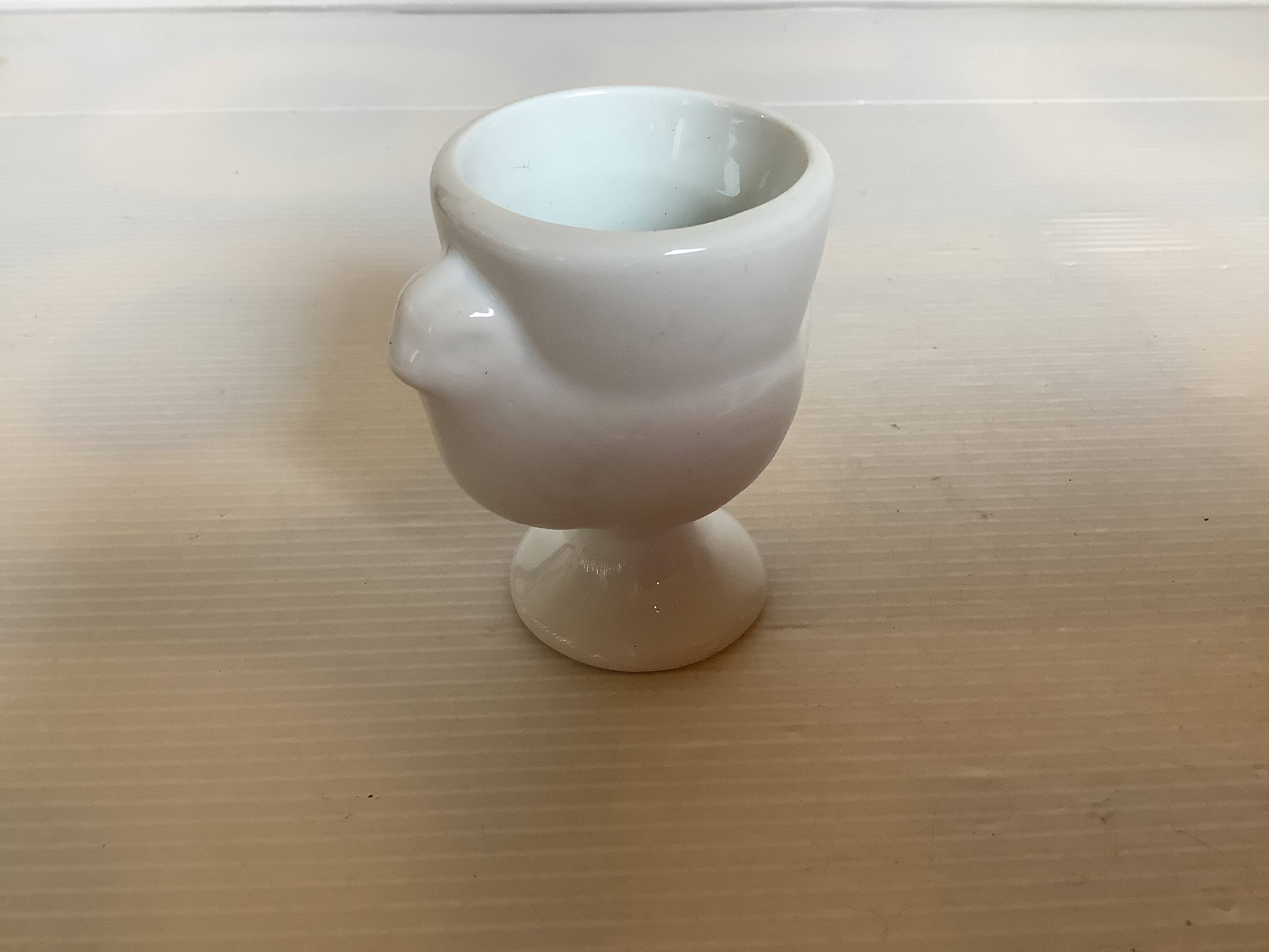 Six white hen egg cups