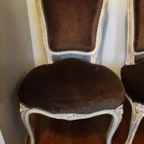 A pair of Louis XV style armchairs in wood and velvet fabrics