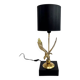 Brass lamp on black lacquered wooden base