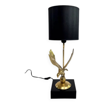 Brass lamp on black lacquered wooden base