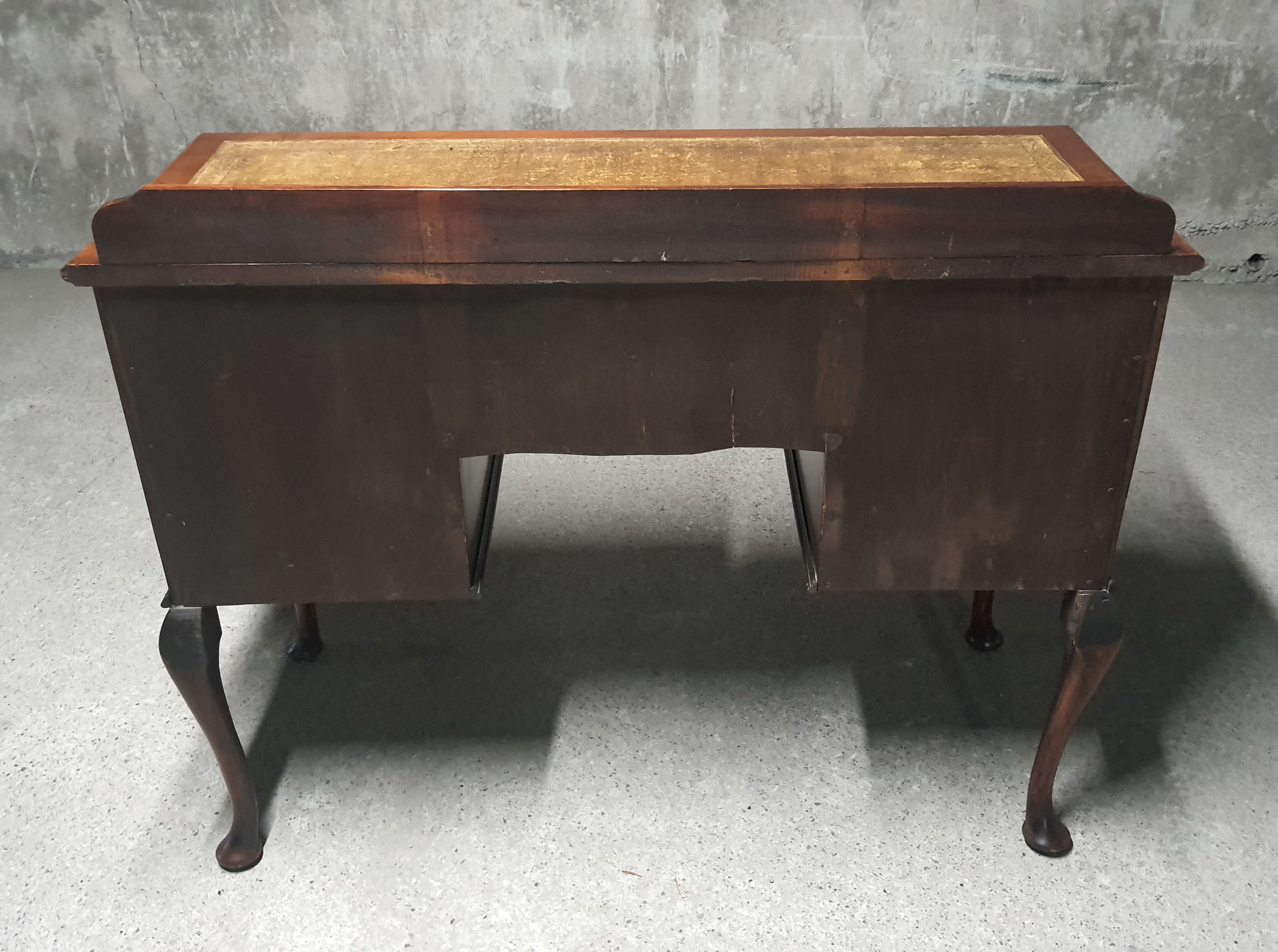 Old desk in cherry and green leather