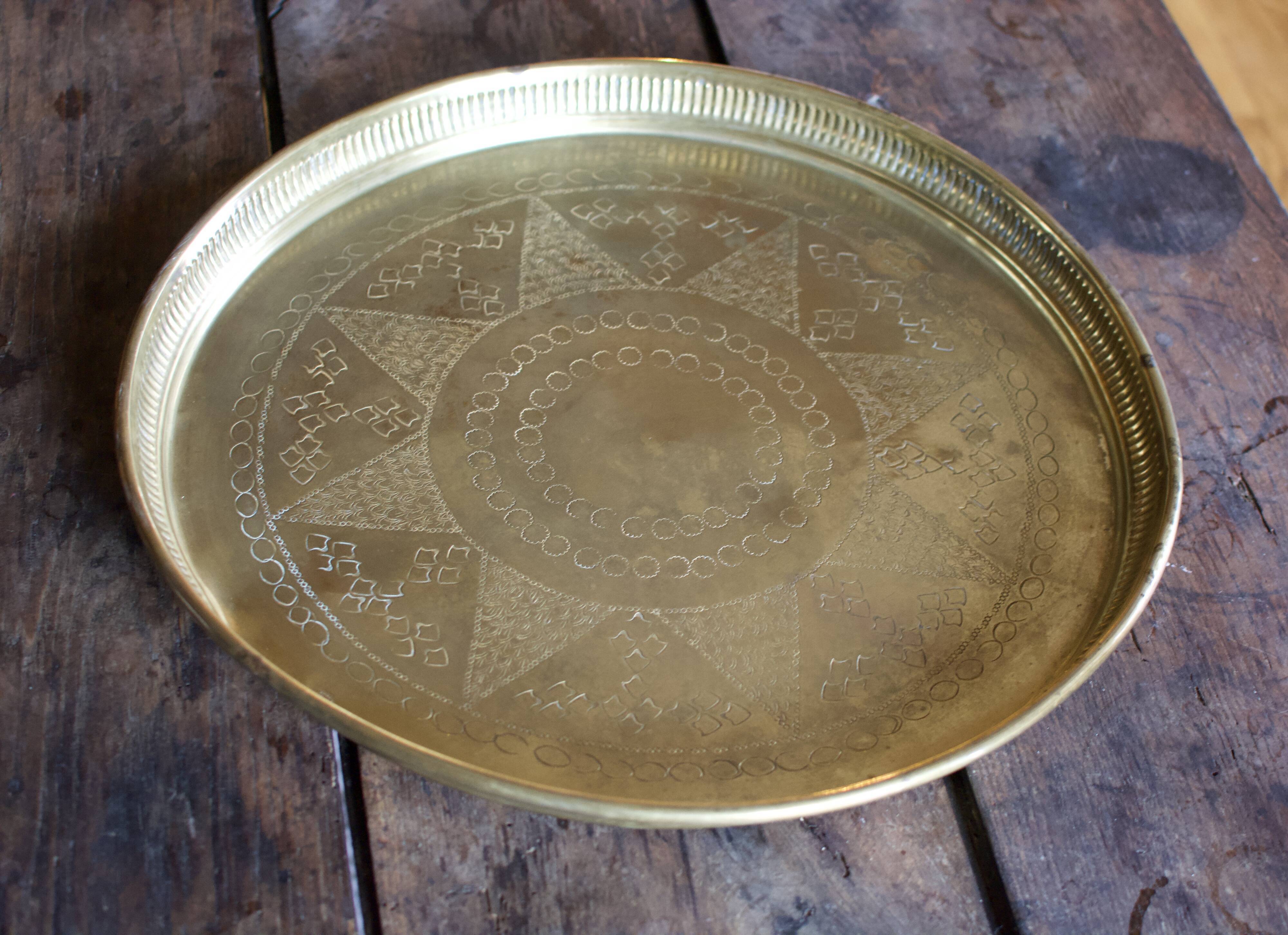 Golden service tray in vintage brass