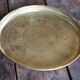 Golden service tray in vintage brass