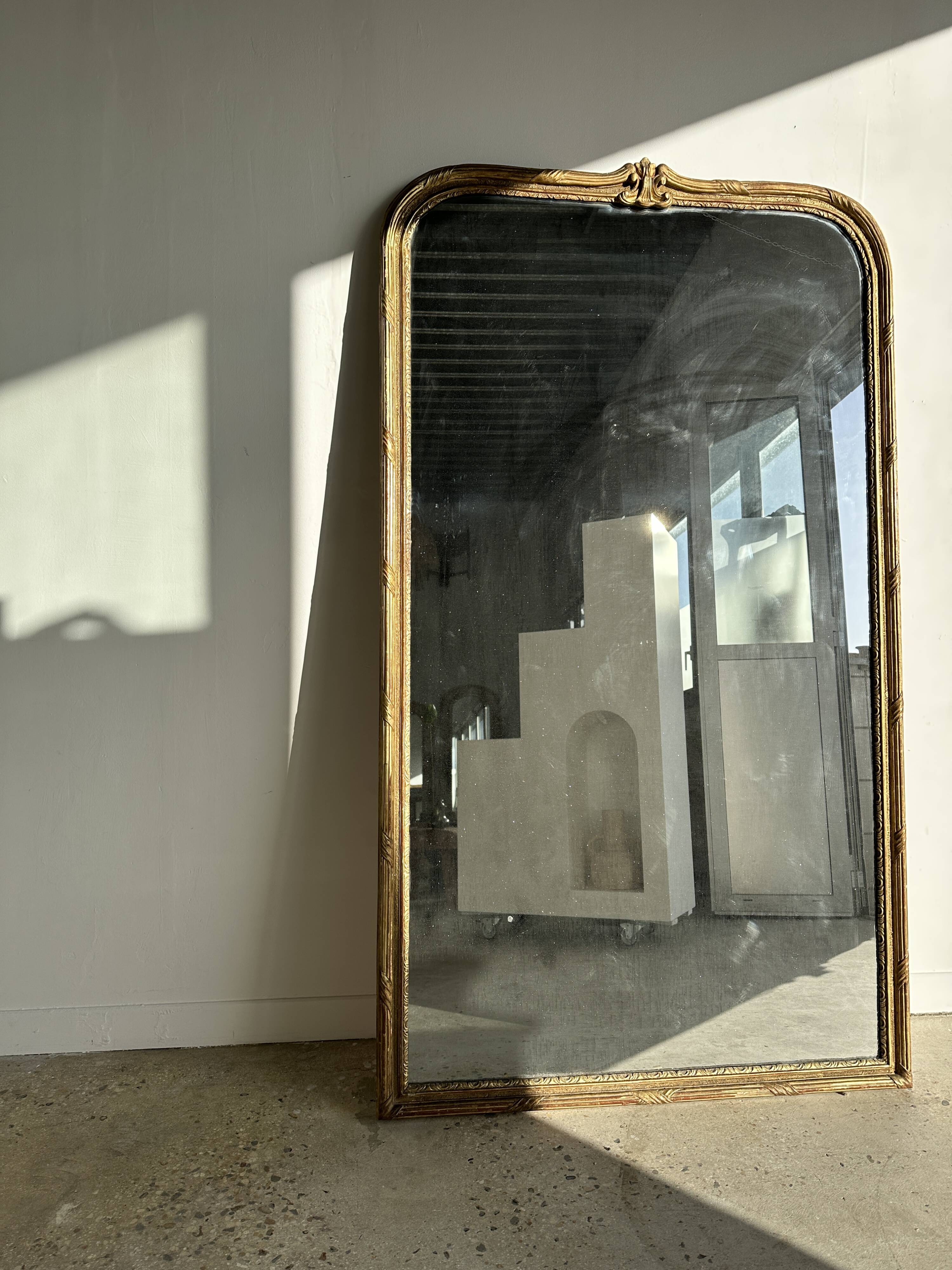 Large gilded mirror 19th century rounded corners mercury glass Louis XVI style