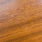 Dining table, 1960s, in walnut, slightly elliptical shape.