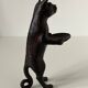 Pockets in the shape of a servant cat in bronze of reddish-brown patina