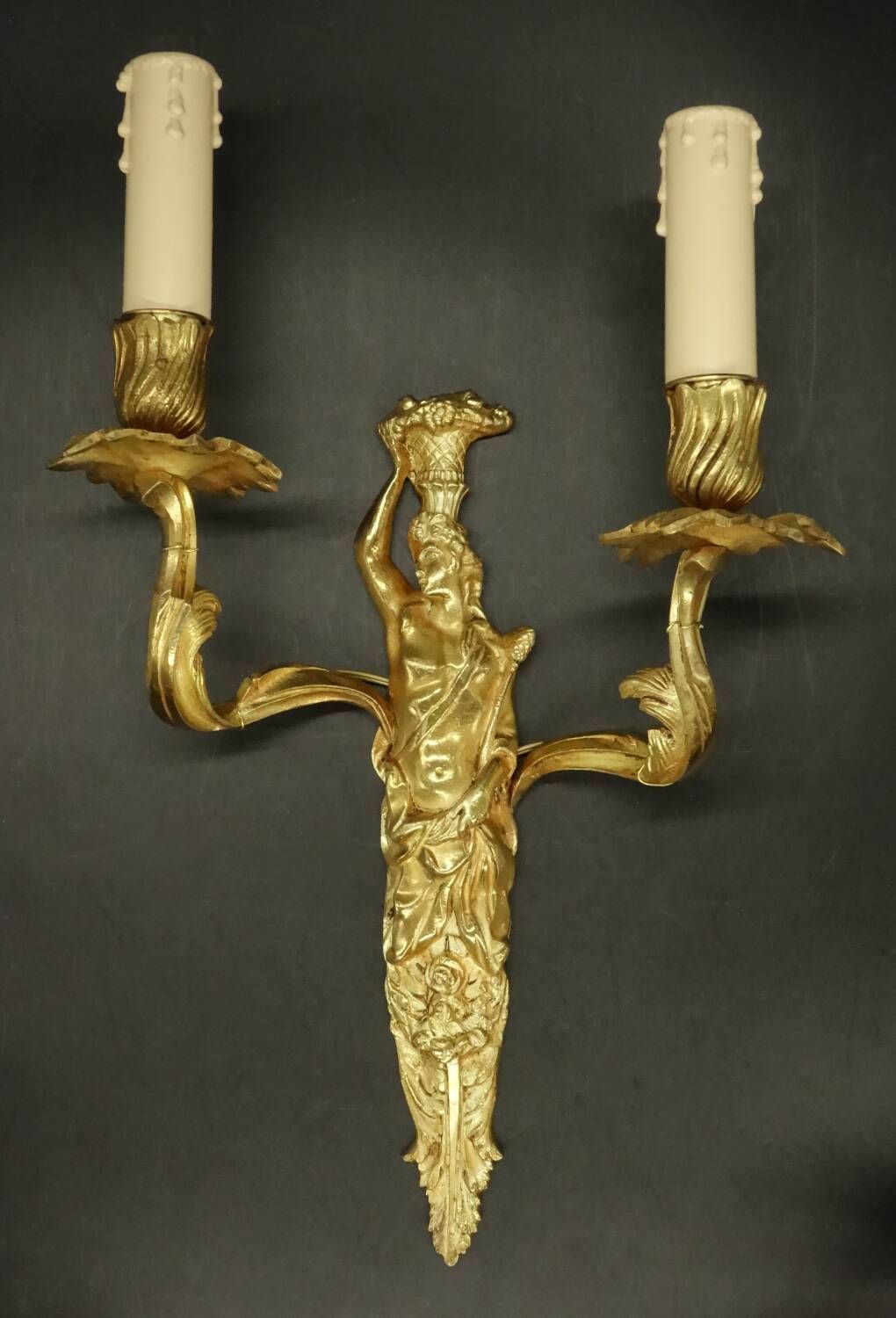 Pair of large caryatid wall sconces in Louis XV style from the 19th century - gilded bronze.