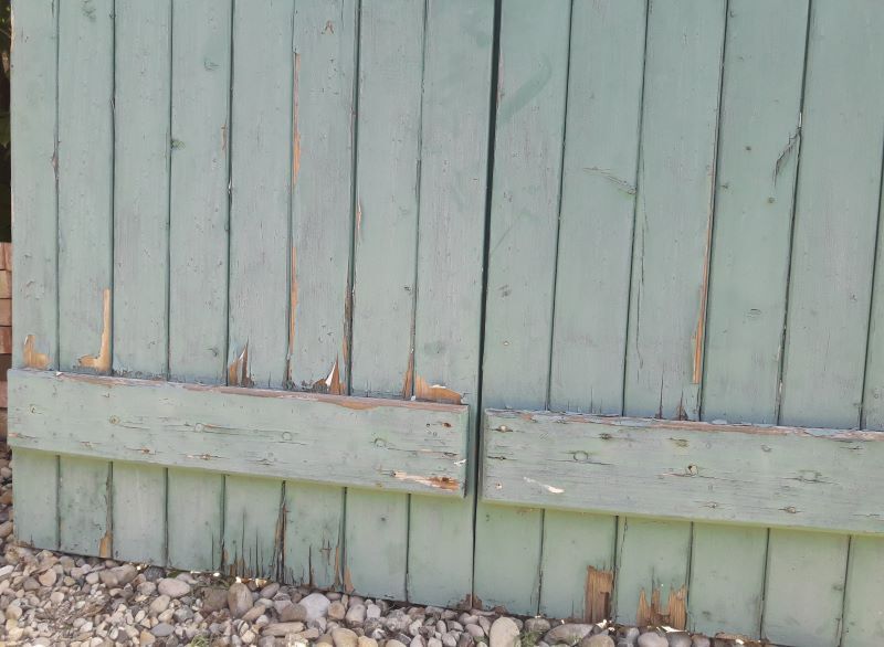 Pair of large wooden iron hanging shutters