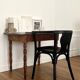 Curved black lacquered wooden armchair in Thonet style