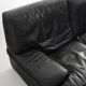 Black leather two-seater sofa. Roche Bobois edition. France, 1980s.
