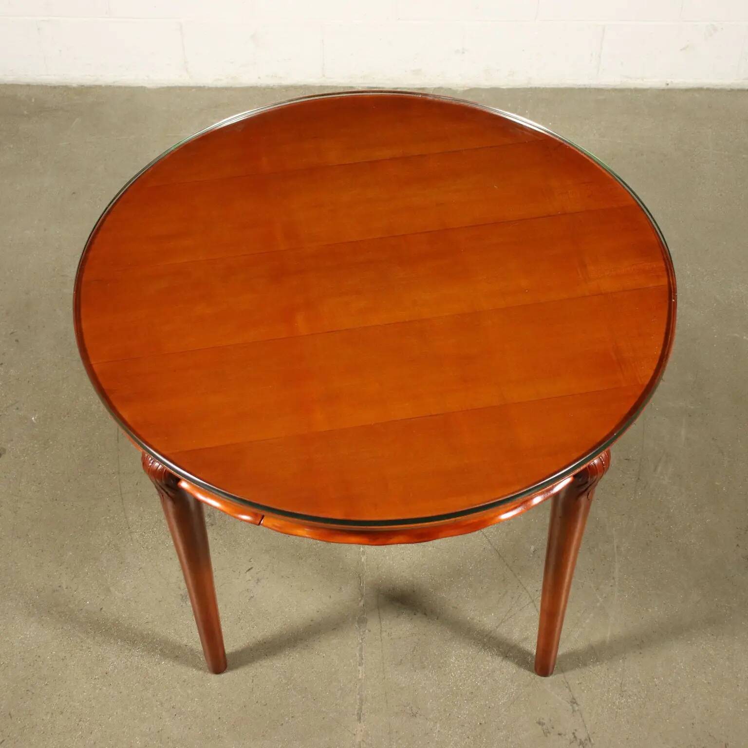 Table in solid beech, mahogany veneer and glass, Italy, 1950s.