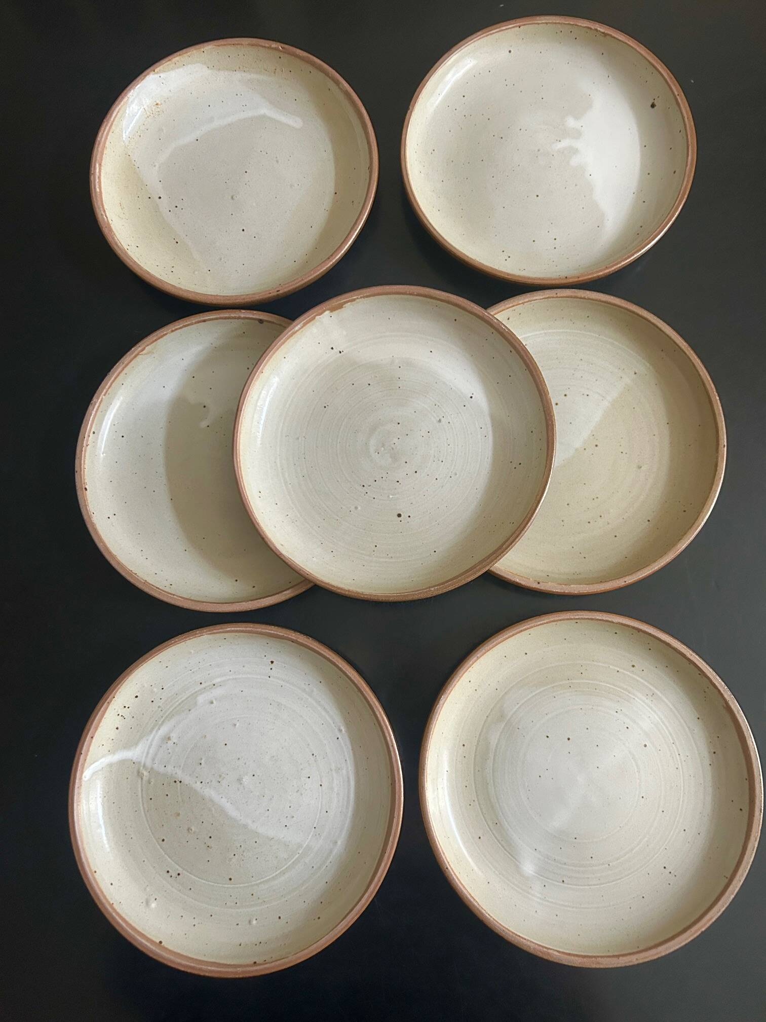 7 stoneware plates 1970