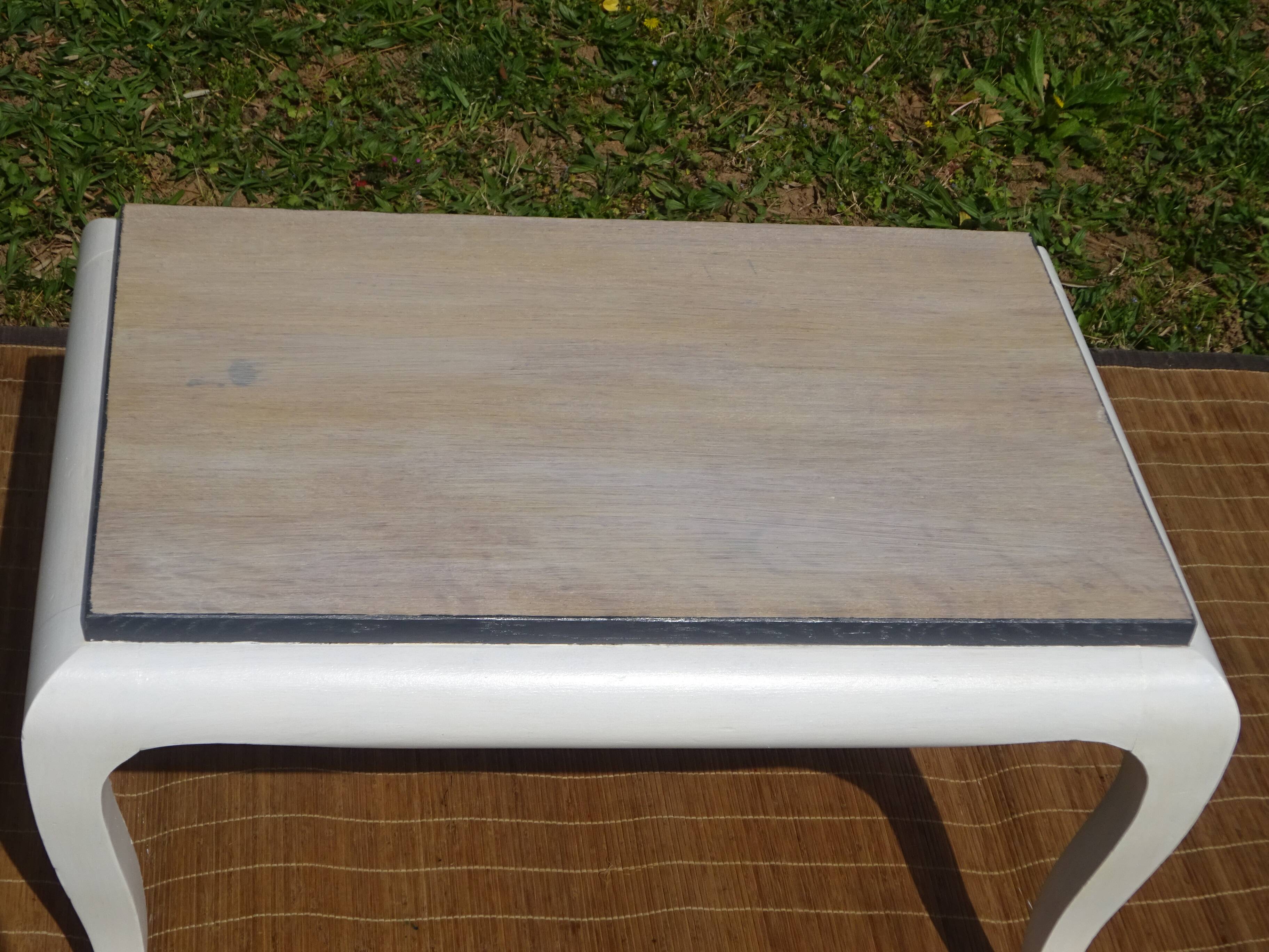 Oak coffee table with curved legs.