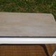 Oak coffee table with curved legs.