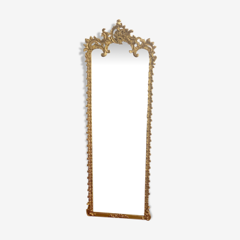 Old mirror between two rare gilded pediments