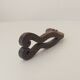 Antique wrought iron door handle with chiselled design.